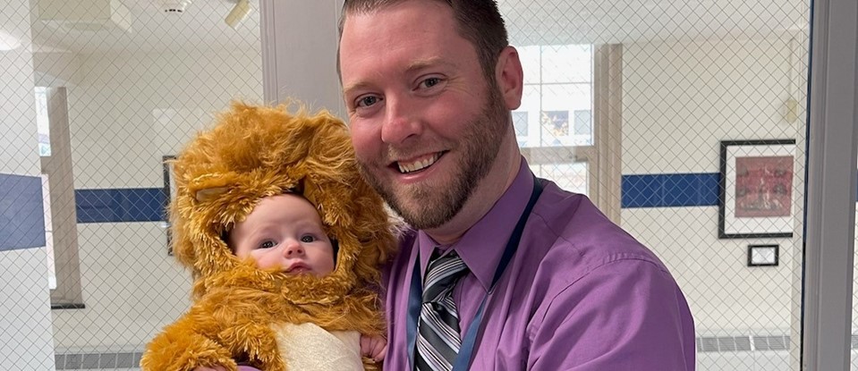 Joe McLaughlin and baby lion for the Halloween parade