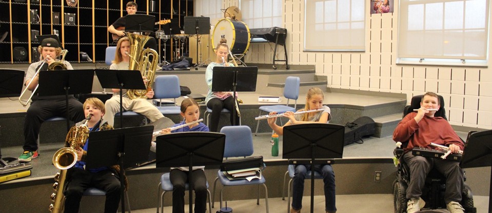 students practicing musical instruments