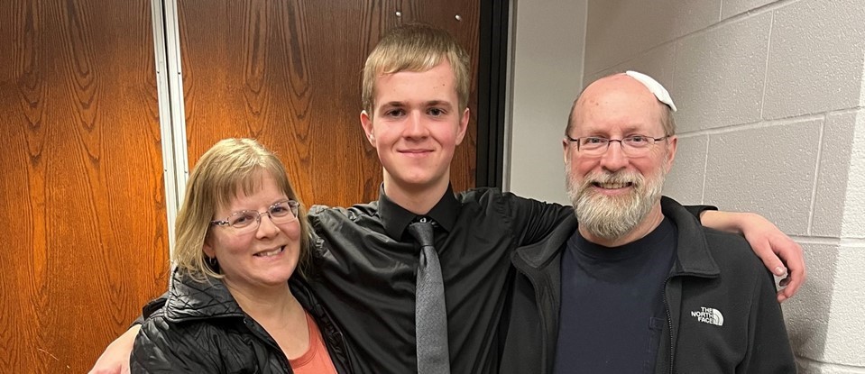 Brendan Pike with his parents at NYSSBA