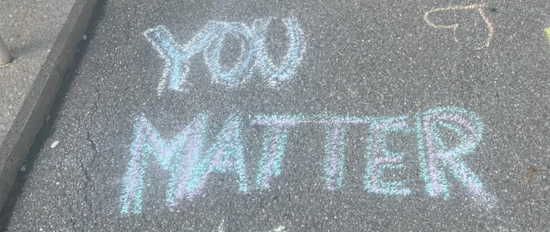 You matter written on sidewalk during &#39;chalk the walk&#39; mental health awareness
