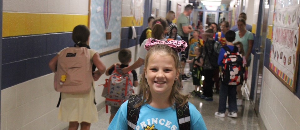 elementary student going to class on first day