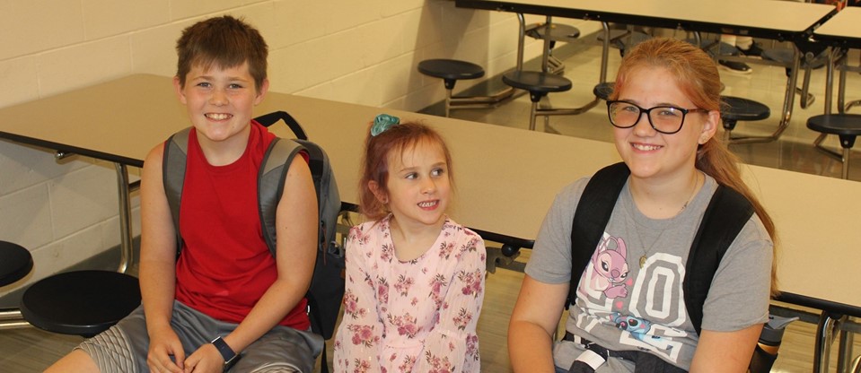 students waiting in the cafe for first morning bell