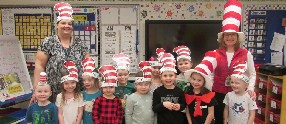 class full of students wearing Dr. Seuss caps