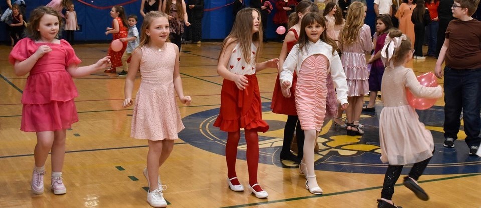 Elementary Students dancing at school dance